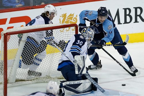 JOHN WOODS / WINNIPEG FREE PRESS
Manitoba Moose goaltender Jamie Phillips (30) makes the wraparound save on Milwaukee Admirals' Justin Kirkland (19) during first period AHL action in Winnipeg on Sunday, December 10, 2017.