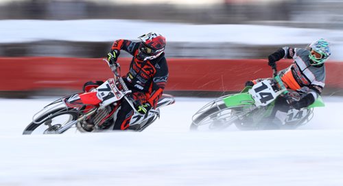 TREVOR HAGAN / WINNIPEG FREE PRESS
Kim Houde (71) of Winnipeg leads Ryan Rondeau (14) of Winnipeg in the Ice Bike Pro Open Final during CPTC racing in Beausejour, Sunday, December 10, 2017.