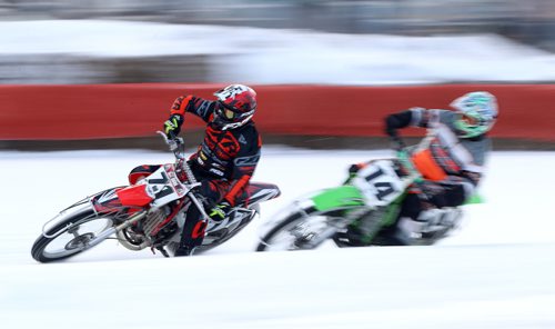 TREVOR HAGAN / WINNIPEG FREE PRESS
Kim Houde (71) of Winnipeg leads Ryan Rondeau (14) of Winnipeg in the Ice Bike Pro Open Final during CPTC racing in Beausejour, Sunday, December 10, 2017.