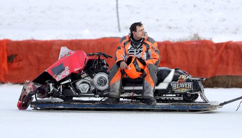 TREVOR HAGAN / WINNIPEG FREE PRESS
Matt Szalai, from Garson, sits on his sled after crashing during the IFS 440x Final during CPTC racing in Beausejour, Sunday, December 10, 2017.