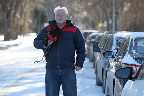 RUTH BONNEVILLE / WINNIPEG FREE PRESS

Photos of Bob Gooding with his dog Meeko, next to a long row of cars parked in from to his home on Pinedale Ave in neighbourhood of Norwood Flats.  The daily grid lock causes problems for him and his neighbours and believes the drivers of these vehicles are mostly hospital staff wanting free parking.

See Rollason story. 

  

Dec 11, 2017