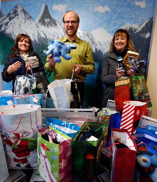WAYNE GLOWACKI / WINNIPEG FREE PRESS

Frank Ulrich, executive director of the Union Gospel Mission with gift bags donated by the Winnipeg Free Press and delivered Monday to the Mission on  Princess St. by advertising executives Karen Buss, Director, at right, and Sandra Sampson, Sales Coordinator. The mission sent out a call for the public to help fill gifts bags for the needy in the area and the Free Press filled and delivered bags for 10 men, 10 ladies, 5 boys and 5 girls. The Union Gospel Mission hands out gifts to everyone who comes to their Christmas Dinner, their Street Ministry and other programs. They are looking for gifts for 300 men, 200 women, and 100 children. Items needed for an adult include razors & shaving cream, shampoo & conditioner, toothpaste & toothbrush, comb or brush,deodorant, Bible,Christian book or CD, socks, hats,gloves & scarves. For Children: new unwrapped toy, new teddy bear, Bible, hats, mitts & scarves, Christian book or CD. Label the gifts for 'man''woman''boy' or 'girl'. They can be placed in small to medium gift bags, shoe boxes, draw string bags or back packs and dropped off at the Mission.  Dec. 11  2017