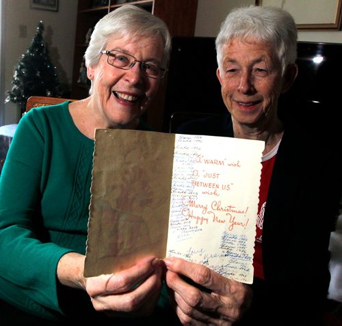 BORIS MINKEVICH / WINNIPEG FREE PRESS
Photo of lifelong friends, from left, Blaine Klatt and Linda Wiebe, and the same 62-year-old Christmas card they have been mailing and handing back and forth since they met when they were 13 years old. For Gord Sinclair column. Dec. 12, 2017