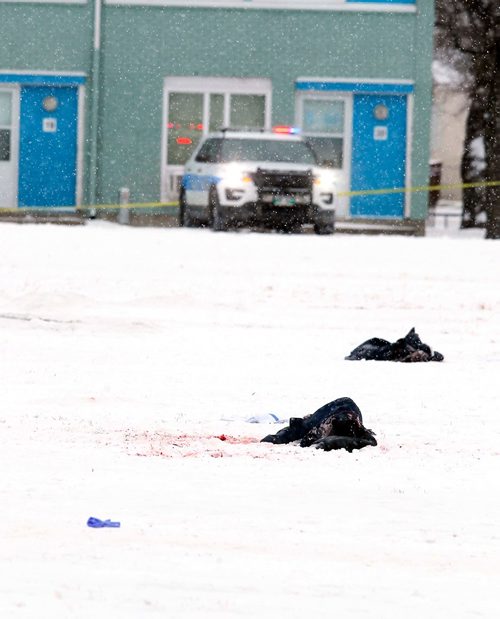 BORIS MINKEVICH / WINNIPEG FREE PRESS
A crime scene in the field near Charles and Flora. A jacket and what looks like blood in the middle of the field. Police tape surrounds the area and police and cadets guard the perimeter. Dec. 13, 2017