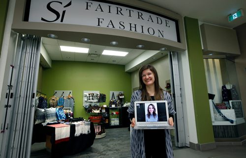 WAYNE GLOWACKI / WINNIPEG FREE PRESS

 Ceilidh Moulden, co-owner and co-founder in her pop up store called  Si Fairtrade Fashion in Cityplace which helps women in Guatemala sustain their income. She is holding her laptop connected by face time to co-owner and co-founder Sarah Cullihall  in Guatemala.  Nadiah Sakurai story Dec. 13  2017