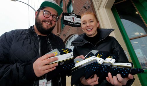BORIS MINKEVICH / WINNIPEG FREE PRESS
Siloam Mission communications director Luke Thiessen and fashion designer Shelley Ediger pose for a photo with socks in front of Siloam Mission. For story about local businesses coming together to raise money for Siloam mission by selling socks. Shelley Ediger is a clothing designer at dEdiger Menswear and is the organizer. Photo with her holding the socks at the SIloam Mission. Nadiah Sakurai story. Dec. 14, 2017