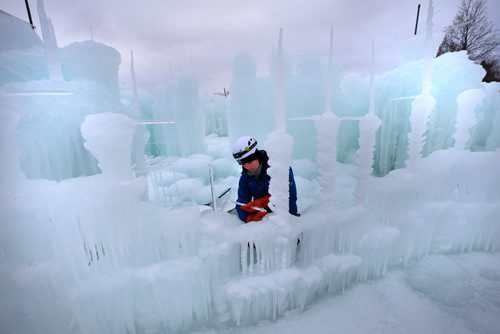 WAYNE GLOWACKI / WINNIPEG FREE PRESS

Jocelyn McLean freezes icicles for a wall foundation at the Ice Castles site at Parks Canada Place at The Forks Historic Site Thursday.  The attraction when completed will include ice towers that will reach 10 metres high, slides. arches, rooms, fountains and tunnels. Workers are growing and harvesting icicles at the site. Each icicle will be shaped and hand-placed onto existing ice formations before being sprayed with water. The ice is embedded with colour-changing LED lights set to a musical soundtrack at night. The Utah-based seasonal entertainment company Ice Castles is scheduled to open in late December or early January (with tickets going on sale around the same time).  Dec. 14  2017