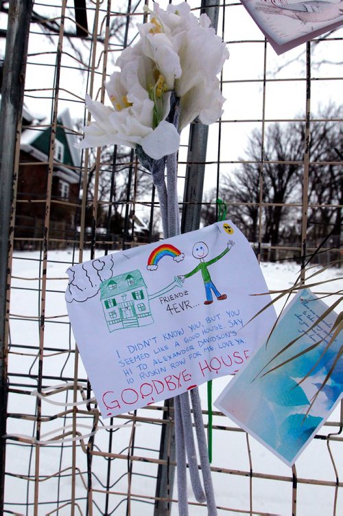 BORIS MINKEVICH / WINNIPEG FREE PRESS
17 Harvard - A memorial set up by upset residents after an old home on their street was demolished. Memorial has cards/flowers at the house. Dec. 15, 2017