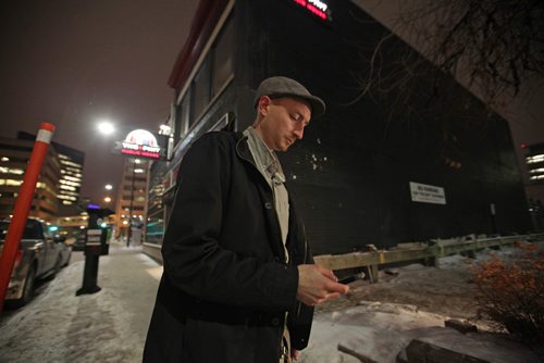 RUTH BONNEVILLE / WINNIPEG FREE PRESS

Winnipeg Free Press reporter Ryan Thorpe books a cab with a online app outside the Pint on Garry street Friday. 
For story on what the local cab service is like.  

See Ryan Thorpe story.   
(ride hailing, ride sharing, uber)
Dec 15, 2017
