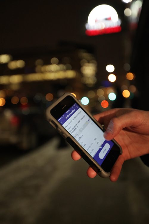 RUTH BONNEVILLE / WINNIPEG FREE PRESS

Winnipeg Free Press reporter Ryan Thorpe books a cab with a online app outside the Pint on Garry street Friday. 
For story on what the local cab service is like.  

See Ryan Thorpe story.   
(ride hailing, ride sharing, uber)
Dec 15, 2017
