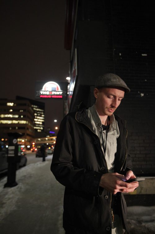 RUTH BONNEVILLE / WINNIPEG FREE PRESS

Winnipeg Free Press reporter Ryan Thorpe books a cab with a online app outside the Pint on Garry street Friday. 
For story on what the local cab service is like.  

See Ryan Thorpe story.   
(ride hailing, ride sharing, uber)
Dec 15, 2017
