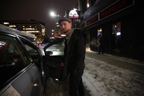 RUTH BONNEVILLE / WINNIPEG FREE PRESS

Winnipeg Free Press reporter Ryan Thorpe books a cab with a online app outside the Pint on Garry street Friday. 
For story on what the local cab service is like.  

See Ryan Thorpe story.   
(ride hailing, ride sharing, uber)
Dec 15, 2017
