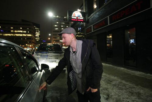 RUTH BONNEVILLE / WINNIPEG FREE PRESS

Winnipeg Free Press reporter Ryan Thorpe books a cab with a online app outside the Pint on Garry street Friday. 
For story on what the local cab service is like.  

See Ryan Thorpe story.   
(ride hailing, ride sharing, uber)
Dec 15, 2017
