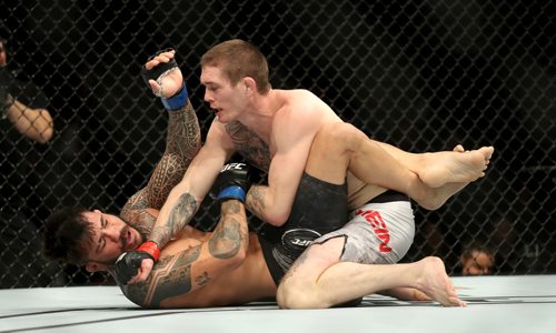 TREVOR HAGAN / WINNIPEG FREE PRESS
Jordan Mein, top, defeats Erick Silva during their welterweight bout to start UFC on Fox 26 at Bell MTS Place, Saturday, December 16, 2017.