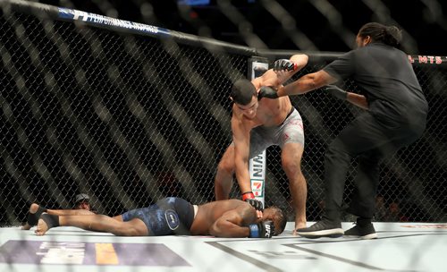 TREVOR HAGAN / WINNIPEG FREE PRESS
Referee Herb Dean rushes in to stop the fight after Alessio Di Chirico knocks out Oluwale Bamgbose during their middleweight at UFC on Fox 26 at Bell MTS Place, Saturday, December 16, 2017.