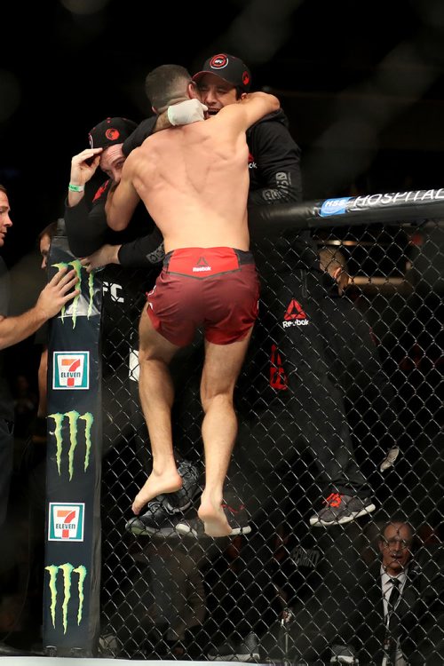 TREVOR HAGAN / WINNIPEG FREE PRESS
Nordine Taleb celebrates with his team after knocking out Danny Roberts early in the first round of their welterweight fight at UFC on Fox 26 at Bell MTS Place, Saturday, December 16, 2017.