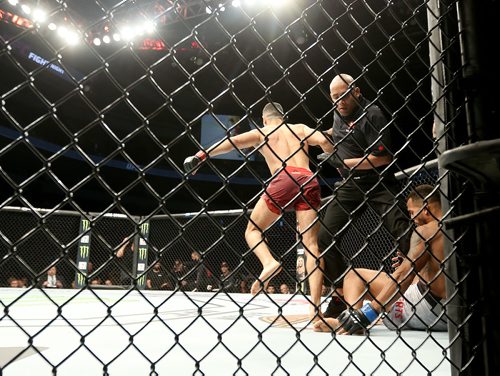 TREVOR HAGAN / WINNIPEG FREE PRESS
Nordine Taleb, left, celebrates with his team after knocking out Danny Roberts early in the first round of their welterweight fight at UFC on Fox 26 at Bell MTS Place, Saturday, December 16, 2017.