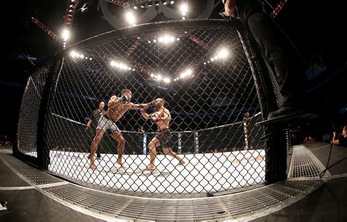 TREVOR HAGAN / WINNIPEG FREE PRESS
Abel Trujillo punches John Makdessi during their fight at UFC on Fox 26 at Bell MTS Place, Saturday, December 16, 2017.