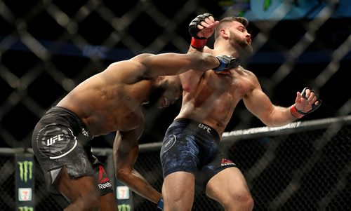 TREVOR HAGAN / WINNIPEG FREE PRESS
Darren Stewart hits Julian Marquez during their middleweight fight at UFC on Fox 26 at Bell MTS Place, Saturday, December 16, 2017. Julian Marquez would go on to win by submission.