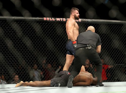 TREVOR HAGAN / WINNIPEG FREE PRESS
Julian Marquez stands over Darren Stewart after submitting him during their middleweight fight at UFC on Fox 26 at Bell MTS Place, Saturday, December 16, 2017.