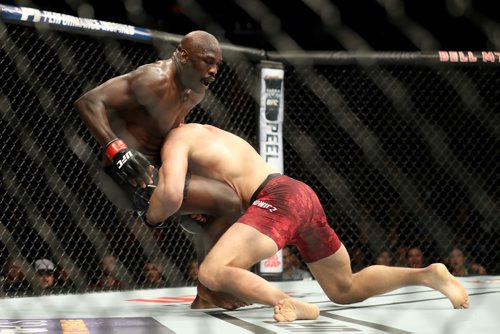 TREVOR HAGAN / WINNIPEG FREE PRESS 
Jan Blachowicz, right, takes down Jared Cannonier during their light heavyweight bout at UFC on Fox 26 at Bell MTS Place, Saturday, December 16, 2017. Blachoqicz would win.