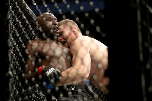 TREVOR HAGAN / WINNIPEG FREE PRESS 
Jan Blachowicz, right, pins Jared Cannonier against the cage during their light heavyweight bout at UFC on Fox 26 at Bell MTS Place, Saturday, December 16, 2017. Blachoqicz would win.