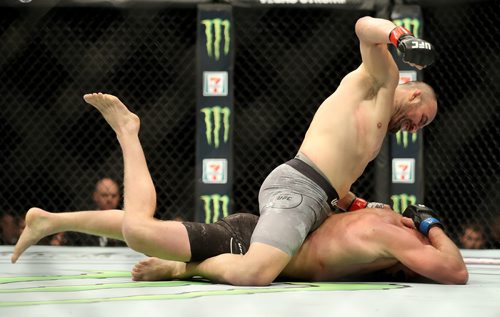 TREVOR HAGAN / WINNIPEG FREE PRESS
Glover Teixeira, top, defeats Misha Cirkunov during their light heavyweight bout at UFC on Fox 26 at Bell MTS Place, Saturday, December 16, 2017. Teixeira would win by TKO.