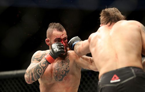 TREVOR HAGAN / WINNIPEG FREE PRESS
Santiago Ponzinibbio, left, defeats Mike Perry during their welterweight bout at UFC on Fox 26 at Bell MTS Place, Saturday, December 16, 2017.