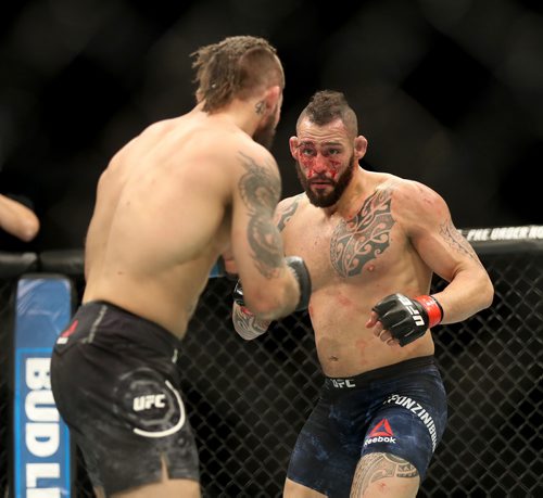 TREVOR HAGAN / WINNIPEG FREE PRESS
Santiago Ponzinibbio, right, defeats Mike Perry during their welterweight bout at UFC on Fox 26 at Bell MTS Place, Saturday, December 16, 2017.