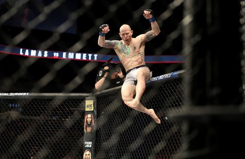 TREVOR HAGAN / WINNIPEG FREE PRESS
Josh Emmett celebrates after knocking out Ricardo Lamas during their featherweight bout at UFC on Fox 26 at Bell MTS Place, Saturday, December 16, 2017.