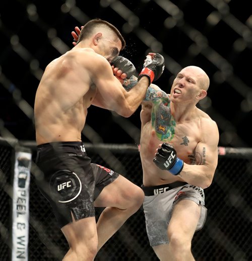 TREVOR HAGAN / WINNIPEG FREE PRESS
Josh Emmett, right, defeats Ricardo Lamas by knockout during their featherweight bout at UFC on Fox 26 at Bell MTS Place, Saturday, December 16, 2017.