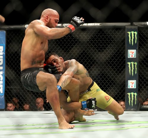 TREVOR HAGAN / WINNIPEG FREE PRESS
Rafael dos Anjos, right, takes down Robbie Lawler during their welterweight bout which was the main event at UFC on Fox 26 at Bell MTS Place, Saturday, December 16, 2017.