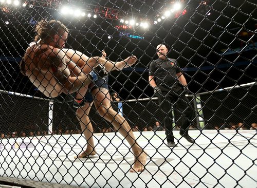 TREVOR HAGAN / WINNIPEG FREE PRESS
Mike Perry is slammed by Santiago Ponzinibbio during their welterweight bout at UFC on Fox 26, Saturday, December 16, 2017.