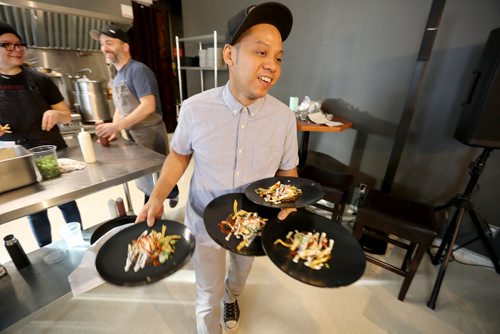 TREVOR HAGAN / WINNIPEG FREE PRESS
Domer Rafael serves Chilaques, the main course, during the Sunday Brunch Collective at the Kitchen Sync, Sunday, December 17, 2017.