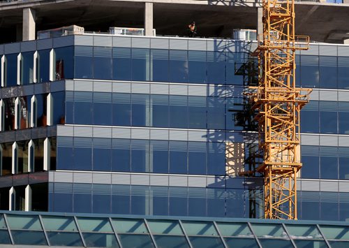 TREVOR HAGAN / WINNIPEG FREE PRESS
A construction worker inside the tower at True North Square, Sunday, December 17, 2017.