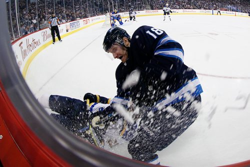 JOHN WOODS / WINNIPEG FREE PRESS
Winnipeg Jets' Bryan Little (18) digs for the puck as St. Louis Blues' Patrik Berglund (21) goes to the ice during second period NHL action in Winnipeg on Sunday, December 17, 2017.