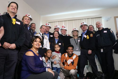 Canstar Community News Dec. 12, 2017 - Habitat for Humanity Manitoba handed over the keys to the eighth family that helped build their home during the Jimmy and Rosalynn Carter Work project. (LIGIA BRAIDOTTI/CANSTAR COMMUNITY NEWS/TIMES)
