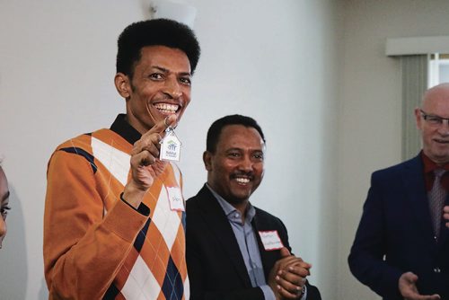 Canstar Community News Dec. 12, 2017 - Mengs holds the keys to his home he heled build at the Jimmy and Rosalynn Carter Work project. (LIGIA BRAIDOTTI/CANSTAR COMMUNITY NEWS/TIMES)