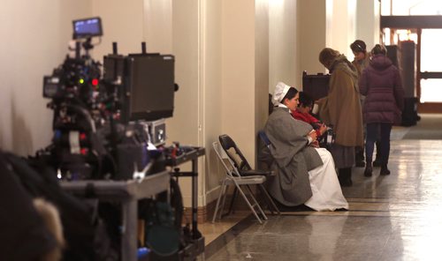 WAYNE GLOWACKI / WINNIPEG FREE PRESS

Members of the film crew and actors wait in the basement hallway of the  Manitoba Legislative Wednesday, they are ¤working on the TV movie Nellie Bly. Dec. 20  2017