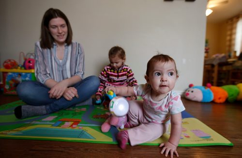 WAYNE GLOWACKI / WINNIPEG FREE PRESS

Ashton Kehler and her one year old miracle baby Lily at right,  and daughter Aria,3.  A year ago, a miraculous surgery led to a most unique delivery of Lily at HSC.Alex Paul story  Dec. 20  2017
