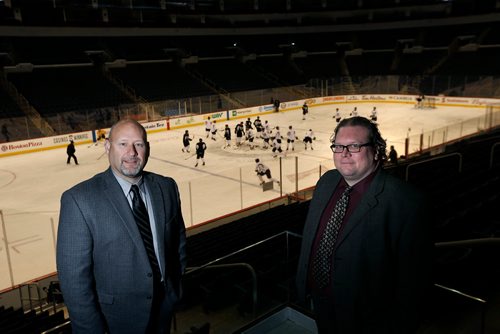 WAYNE GLOWACKI / WINNIPEG FREE PRESS

Winnipeg Free Press Sports writers Jason Bell,left, and Mike McIntyre in Bell MTS Place.  Dec. 21  2017