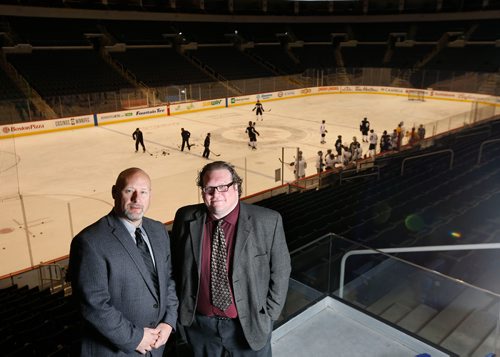 WAYNE GLOWACKI / WINNIPEG FREE PRESS

Winnipeg Free Press Sports writers Jason Bell,left, and Mike McIntyre in Bell MTS Place.  Dec. 21  2017