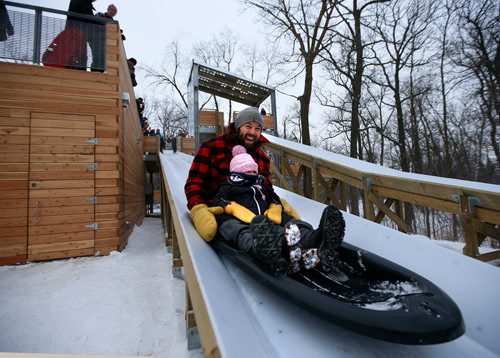 WAYNE GLOWACKI / WINNIPEG FREE PRESS  

Once the ribbon cutting was completed, Canadian Paralympic Gold Medallist Billy Bridges and his two year old daughter Kensi were the first down the slide at the official opening of the St.Vital Parks new treetop lookout, toboggan slides and warming shelter Friday. Kiera Kowalski story Dec. 22  2017