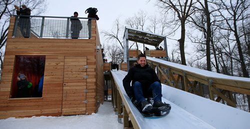 WAYNE GLOWACKI / WINNIPEG FREE PRESS

Mayor Brian Bowman takes a ride after the official opening of the St.Vital Parks new treetop lookout, toboggan slides and warming shelter Friday. Kiera Kowalski story Dec. 22  2017