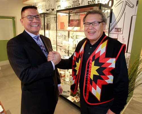 BORIS MINKEVICH / WINNIPEG FREE PRESS
National Access Cannabis and Brokenhead Ojibway Nation Sign Limited Partnership Agreement. From left, Onekanew Christian Sinclair of Opaskwayak Cree Nation and Chief Jim Bear of Birkenhead Ojibway Nation pose for a photo at National Access Cannabis, 379 Broadway #101. Solomon Israel story. Dec. 22, 2017