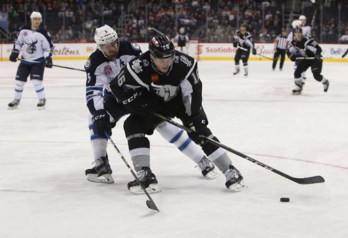 RUTH BONNEVILLE / WINNIPEG FREE PRESS

Manitoba Moose #5 Cameron Schilling tries to get the puck from San Antonio Rampage #16 Dominic Toninato during 1st period action at MTS Centre Friday night.   Score after the 1st period is 2 - 0 for Moose.   


Dec 22, 2017

