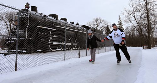 WAYNE GLOWACKI / WINNIPEG FREE PRESS

Derrick and Carla Siemann glide past the CN steam locomotive along the Terry Fox Fitness Skating Trail at¤Assiniboine Park that opened Saturday. It's a one-way,¤1-km trail loop that starts at the warming hut just by the park's main entrance off Corydon Ave & Roblin Blvd.  Dec. 23  2017