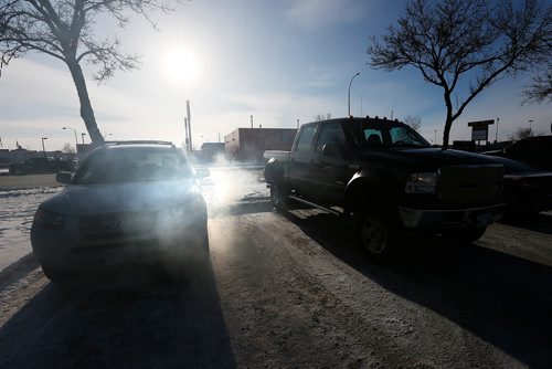JOHN WOODS / WINNIPEG FREE PRESS
Driverless vehicles are left running in Regent Avenue parking lots Sunday, December 24, 2017. Police are asking people not to leave cars idling as it makes car theft easier.