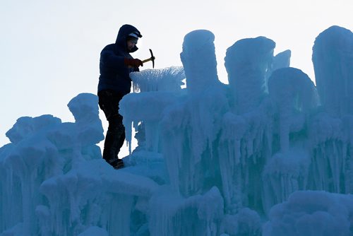 JOHN WOODS / WINNIPEG FREE PRESS
Ice Castle Site Manager Blake Hawbaker works on the Ice Castle at the Forks Tuesday, December 26, 2017. Management says they plan on opening in January, but people can check their website ice castles.com or their social media for updates.