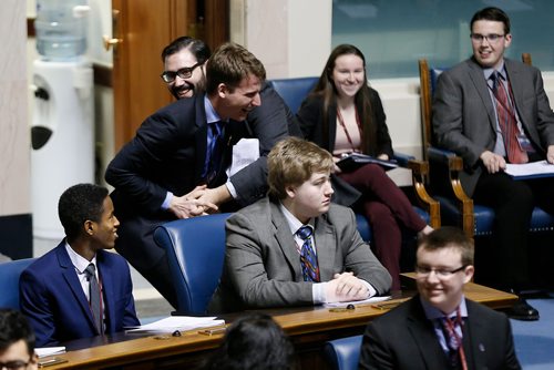 JOHN WOODS / WINNIPEG FREE PRESS
Speaker Joey Broda (front) is "caught" by Premier Ariel Melamedoff as part of the opening ceremonies of the 96th Winter Session of the Youth Parliament of Manitoba at the Manitoba Legislature Tuesday, December 26, 2017.